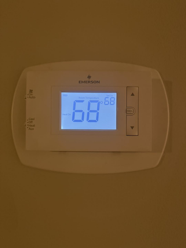 An Emerson digital thermostat displaying 68 degrees, installed by EndorFin Service's Inc. Heating & Air Conditioning in Gloucester, VA.