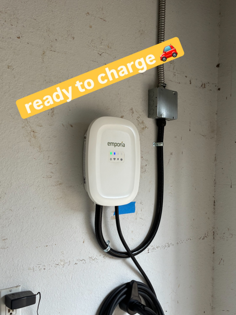 An Emporia EV charger professionally installed on a wall by ChargerPro in Denver, CO.