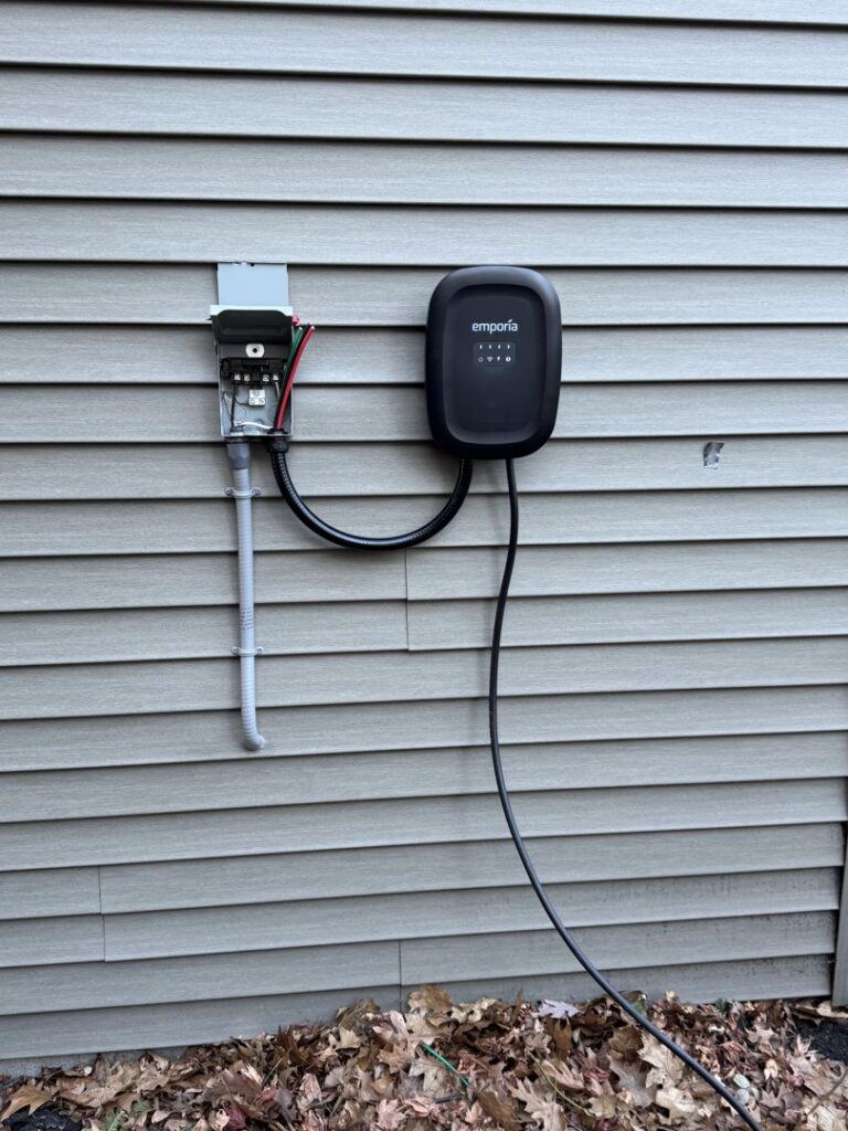 An Emporia EV charger installed on the exterior of a home by Ramos Electrical services inc in Brownsville, TX