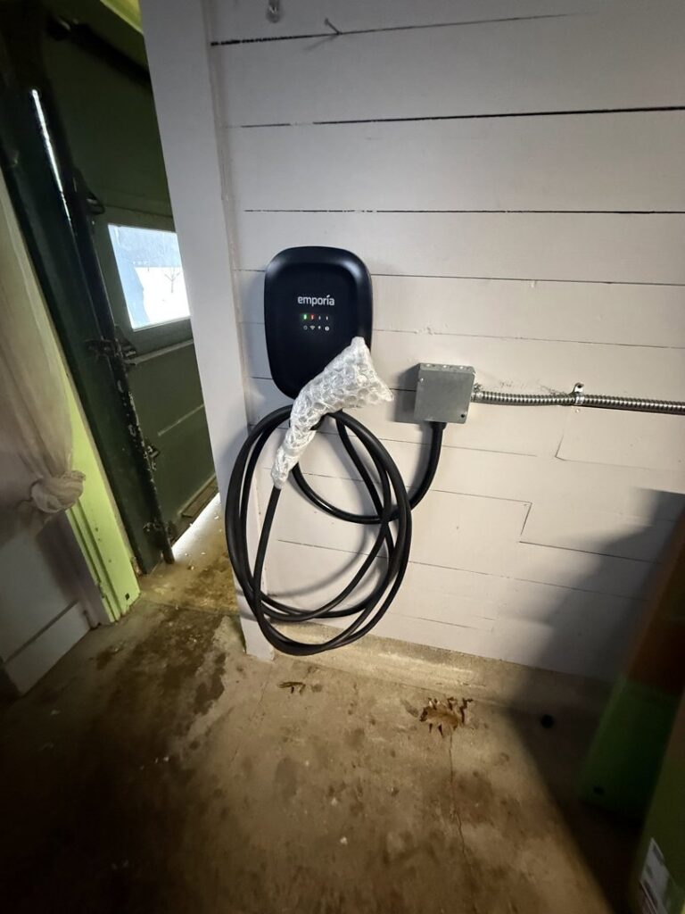 An Emporia EV charger installed on a wall, ready for use, by Rockys electric in La Junta, CO.