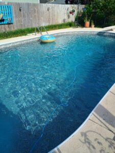 An empty, newly lined rectangular pool with steps, demonstrating liner installation by Brian's Pool Service in Baton Rouge, LA.