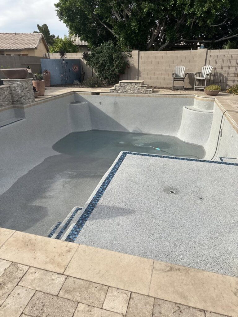 An empty swimming pool being refilled with water, indicating service by Pool Pals in Franklin, MA.