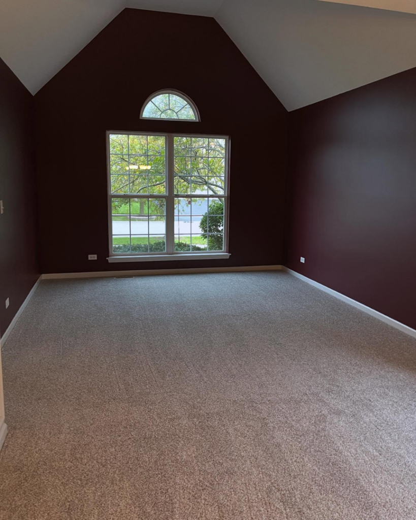 An empty room featuring a fresh light brown carpet installation by Rosas Carpet & Flooring in Shorewood, IL.