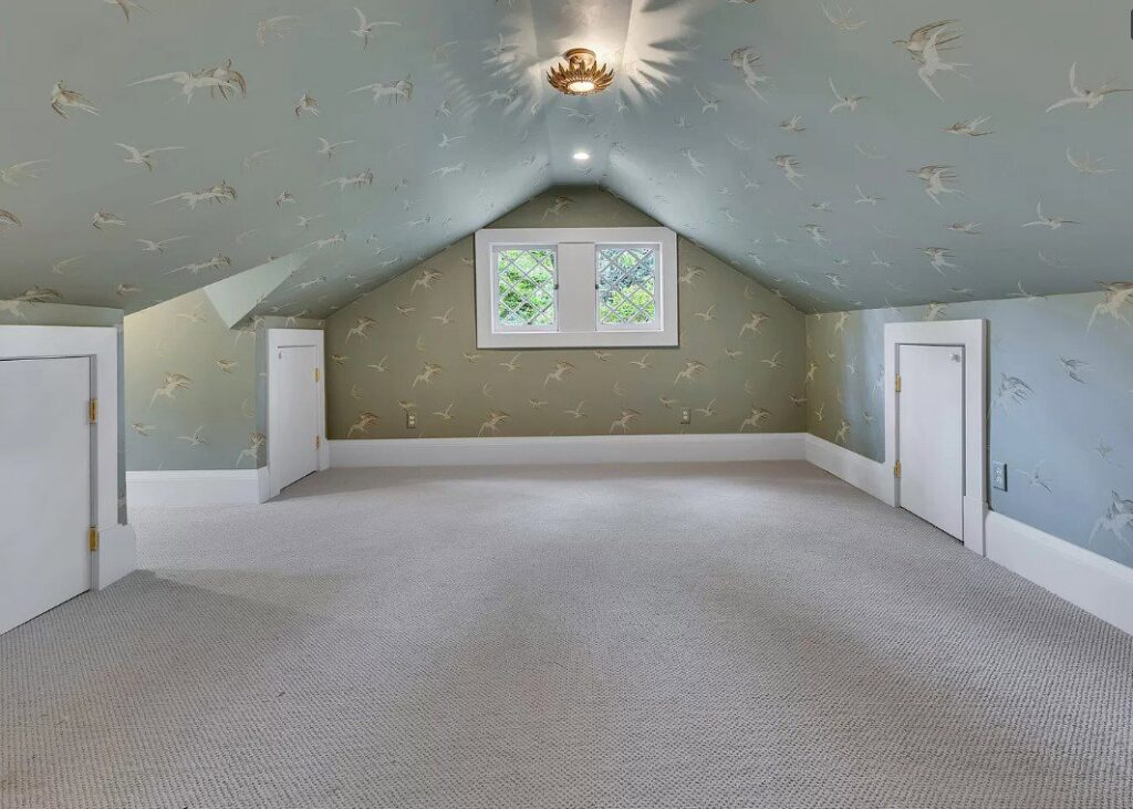 An empty room featuring new wall-to-wall carpet installed by Faith and Grace Flooring in Murfreesboro, TN.