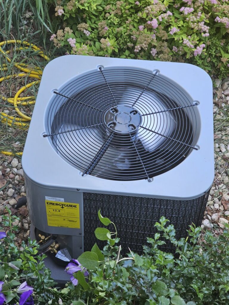 An energy-efficient outdoor AC unit installed by Wight's Heating & Air Conditioning in Rockford, IL