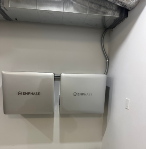 Two Enphase energy storage units installed on a wall by Clemens Electric in Averill Park, NY