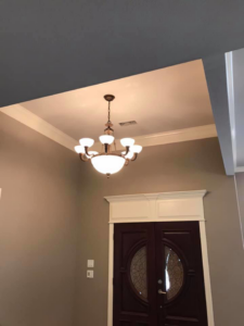 Elegant chandelier and electrical outlets installed in a home entryway by JMD Electric, LLC in O'Fallon, MO.