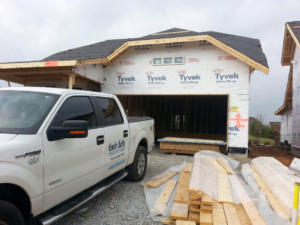 An Envirosafe Termite & Pest Control truck parked at a new construction site in Louisville, KY.