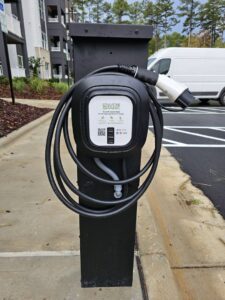 An EnviroSpark EV charging station installed outdoors, a specialized service from 8Thirty Electric, Inc. in Johns Creek, GA.