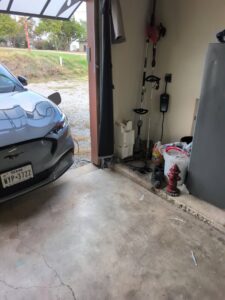 Electric vehicle charger installed in a garage by TJAM Electric in Springtown, TX.