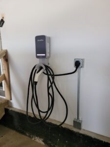 An installed EV charger with conduit, showcasing an electrical service by Illiana Electrical in Whiting, IN