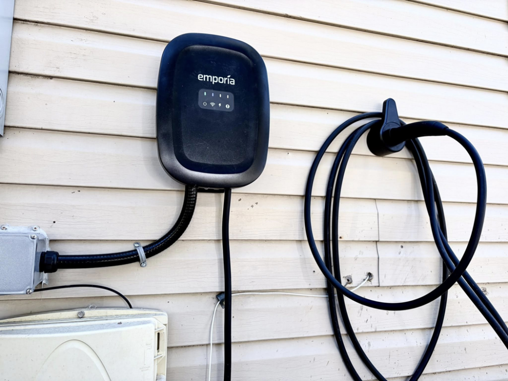 An Emporia EV charger professionally installed on a home's exterior by MLEC in Annapolis, MD