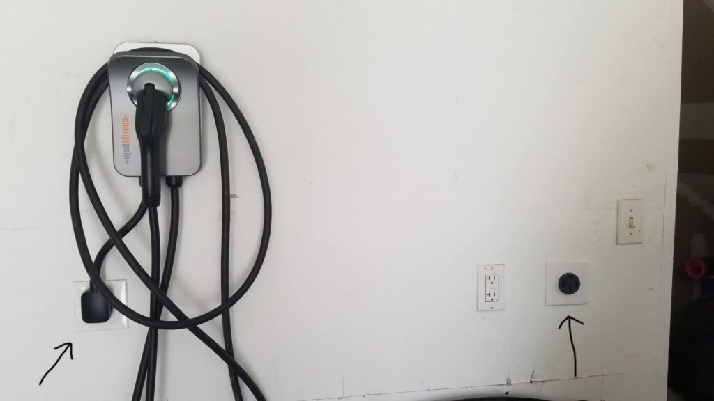 An electric vehicle (EV) charging station installed in a garage by Molitor Electric, offering convenient charging in Austin, TX.