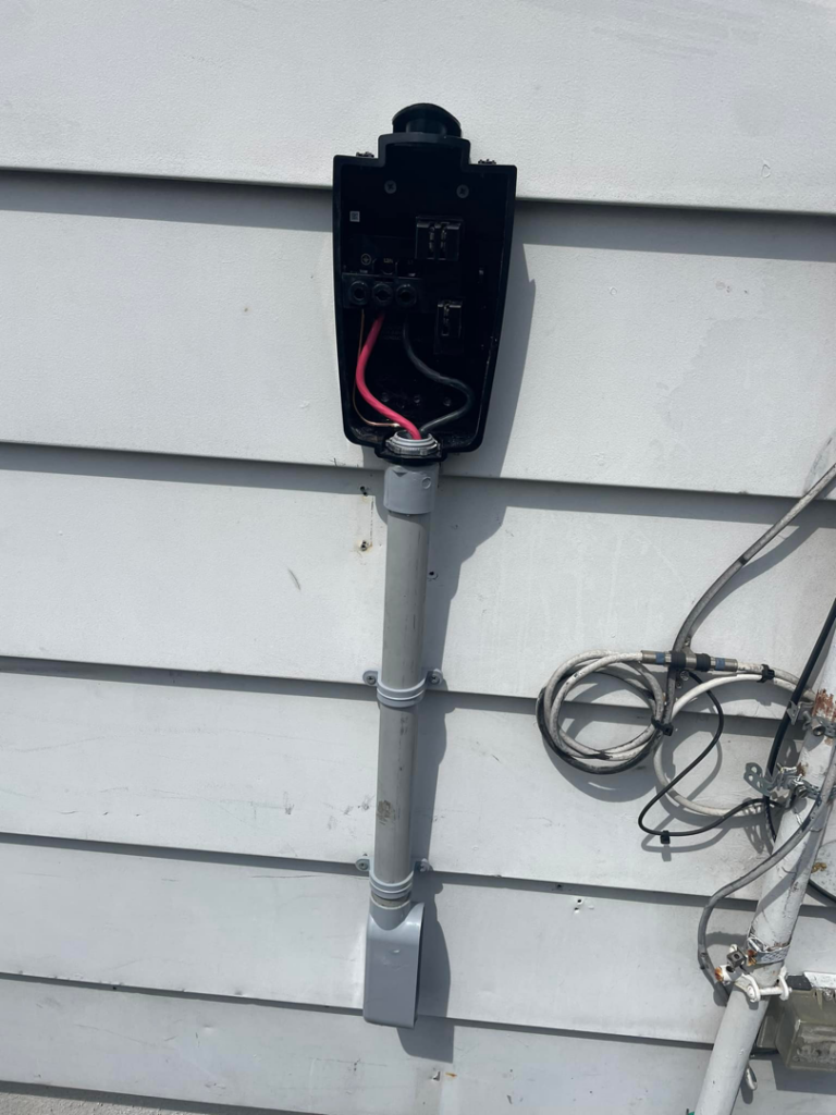 Close-up of an electric vehicle charger's wiring during installation by Ruben's Electric in Harlingen, TX