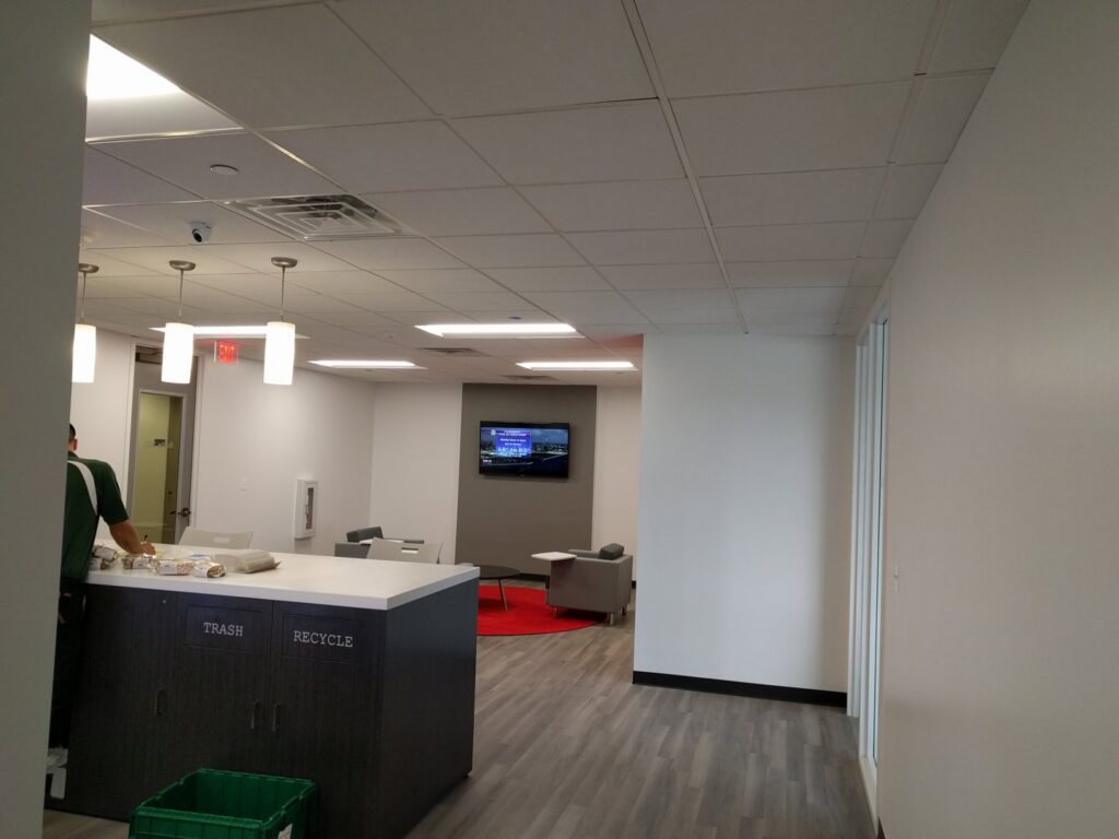 Electric vehicle charging station installed in a garage with visible conduit by VIP Electrical Services in Naperville, IL.