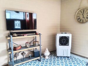 An evaporative cooler providing comfort in a living area by Cajun Kooling in Broussard, LA