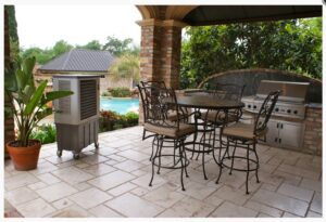 An evaporative cooler cooling an outdoor kitchen and pool area by Cajun Kooling in Broussard, LA