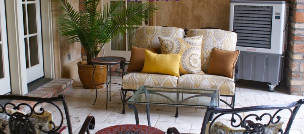 An evaporative cooler providing comfort for an outdoor seating area by Cajun Kooling in Broussard, LA