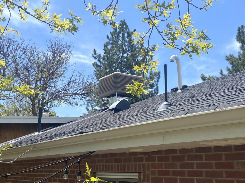 An evaporative cooler (swamp cooler) installed on a residential roof by True Heating and Cooling in Westminster, CO.