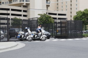 Event security fencing with police motorcycles providing perimeter control by Checkmate Global in Frederick, MD.