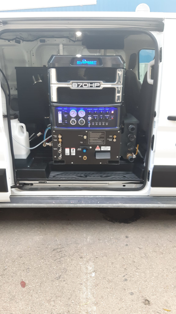 An Everest 870HP truckmount carpet cleaning machine installed in a service van for Delmac Products Truckmount Service in Bakersfield, CA.