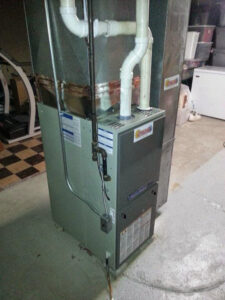 An existing furnace system with ductwork in a basement by Complete Comfort Heating & Cooling in Kenosha, WI.