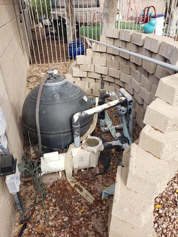 An existing pool equipment area with a pump and filter, ready for service by East Mesa Pools, LLC in Mesa, AZ.