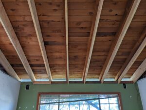 Exposed ceiling joists with visible electrical rough-in, showcasing new construction wiring by Primo's Electrical Services in San Diego, CA.