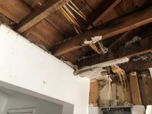 Exposed electrical wiring running through ceiling joists during a residential project by RHS Electrical Services in Westerville, OH.