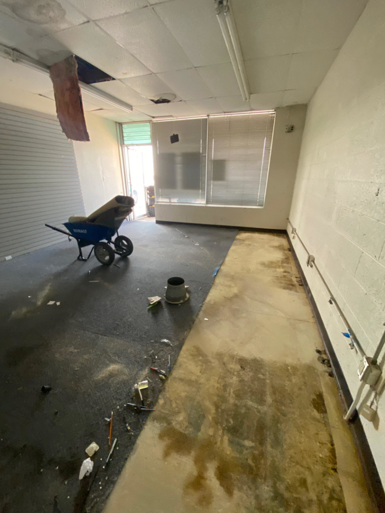 Exposed electrical conduits and junction boxes on a wall during a commercial renovation by Redbud Current Co., LLC in Tulsa, OK.