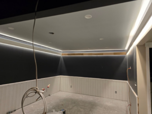 Exposed electrical wires hanging from a ceiling during an installation project by LANG ELECTRIC in Knoxville, TN.