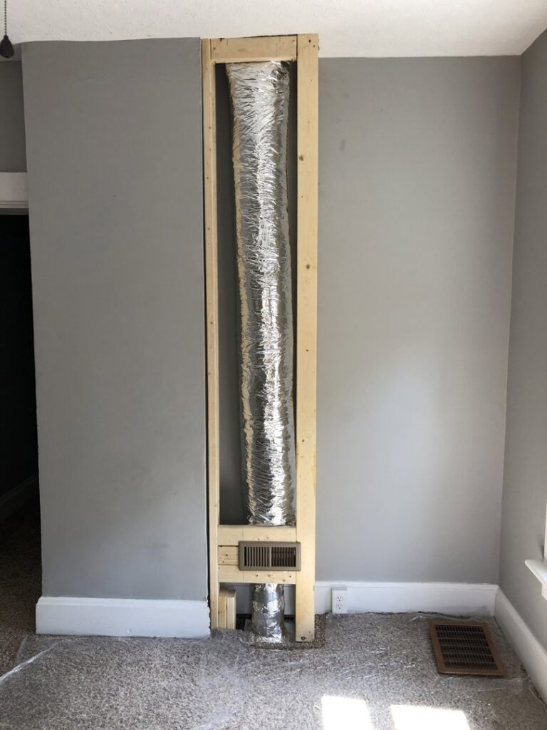 Exposed flexible ductwork and a floor vent during an HVAC installation by Inspired Heating & Cooling, Electric, Roofing, Repair LLC in Columbus, OH.