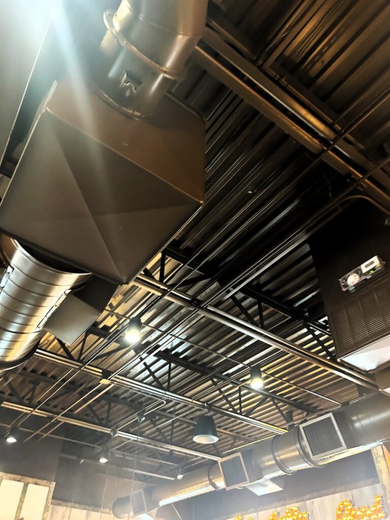 Exposed HVAC ductwork and ventilation systems installed on a commercial ceiling by HP Mechanical LLC in Santa Rosa, CA.
