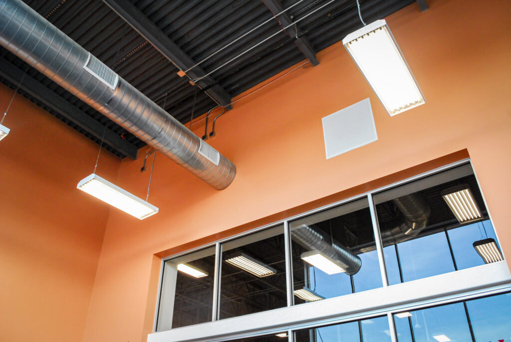 Exposed HVAC ductwork and ventilation systems installed in a commercial ceiling by Air-Flow Mechanical Services, Inc. in Cincinnati, OH.