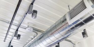 Exposed spiral HVAC ductwork and ventilation in a commercial building, installed by Furnace Doctors Heating & Air Conditioning LLC in Champaign, IL