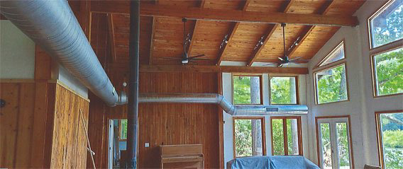 Exposed HVAC ductwork installed along the ceiling in a building by Childers Air Plumbing & Electric in Beckley, WV.