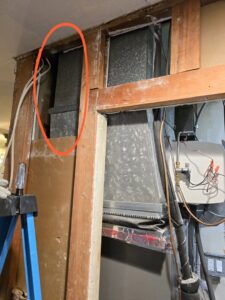 Exposed HVAC ductwork and framing during an installation or repair project by Crain Heating and Cooling in Jeffersonville, IN.