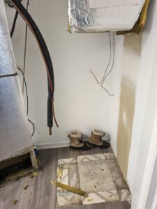 Exposed HVAC ductwork and wiring during an installation or repair project by ECA DuctWorks in Reston, VA