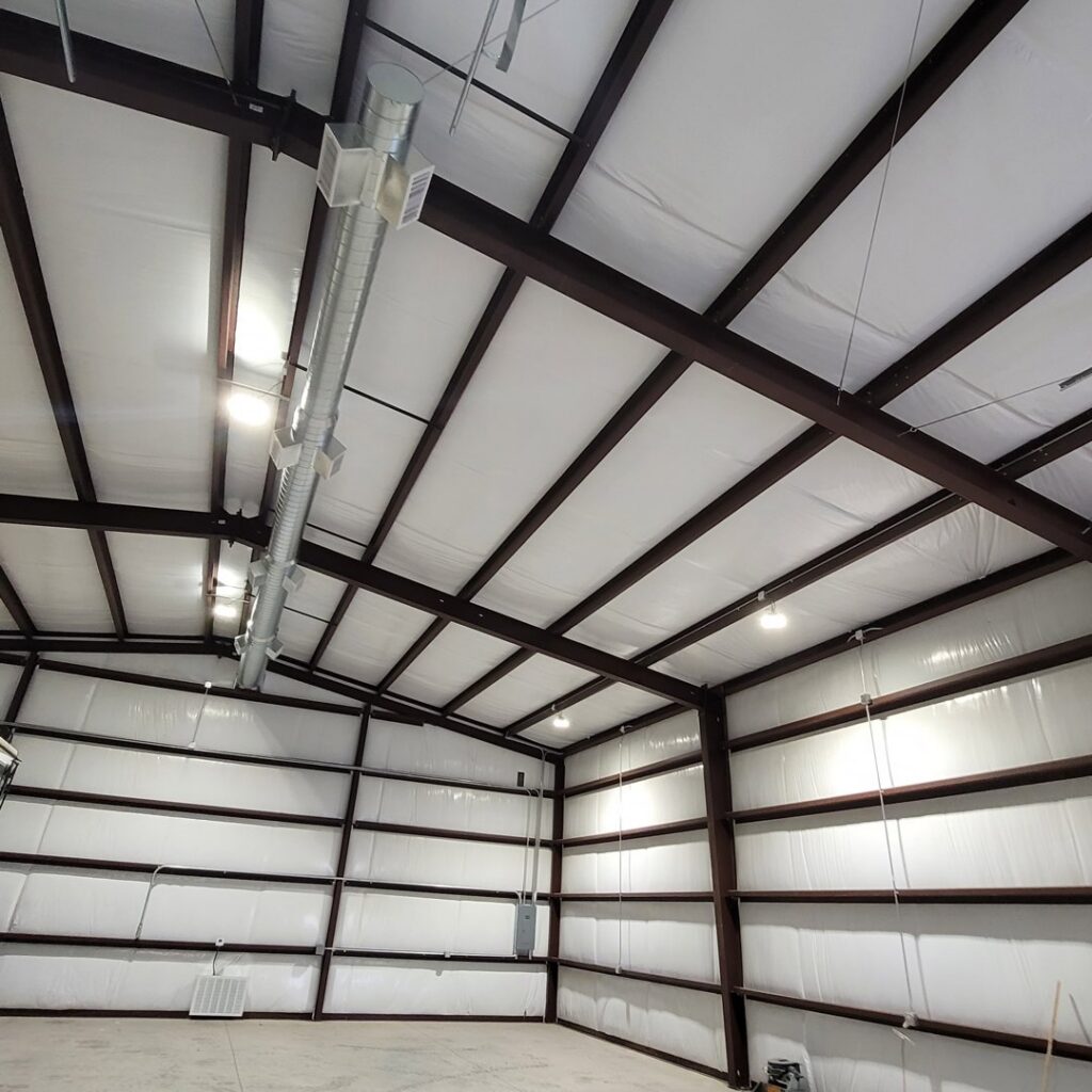 Exposed round HVAC ductwork installation in a commercial building by After Hours Heating & Air Conditioning LLC in Chesapeake, VA.