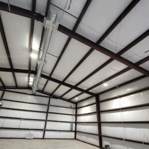 Exposed round HVAC ductwork installation in a commercial building by After Hours Heating & Air Conditioning LLC in Chesapeake, VA.