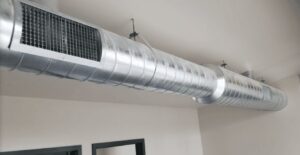 Exposed spiral ductwork with grilles installed in a commercial space by Semenik Hvac/r in Spokane, WA.