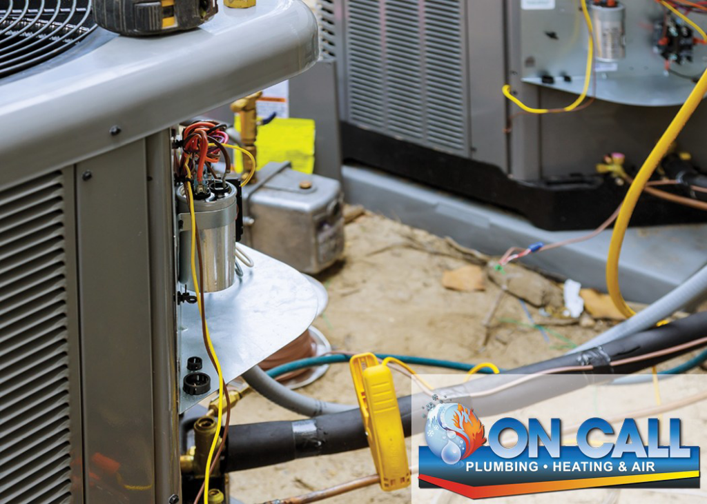 Close-up view of exposed wiring and internal components of an outdoor AC unit by On Call Plumbing, Heating & Air in Columbia, SC