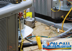 Close-up view of exposed wiring and internal components of an outdoor AC unit by On Call Plumbing, Heating & Air in Columbia, SC