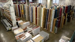 Extensive inventory of carpet rolls and other flooring materials at Georgia Floors Direct in Tallahassee, FL