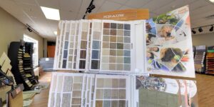 An extensive display of various carpet samples in the showroom of West Michigan Flooring & Interiors in Byron Center, MI.