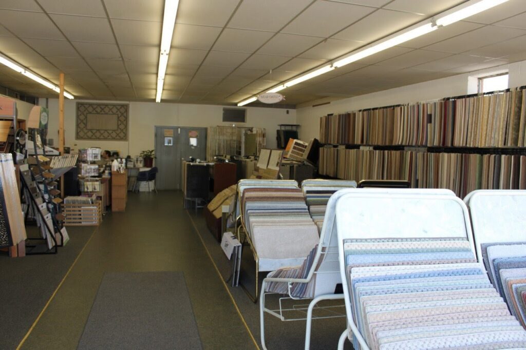 An extensive display of carpet sample racks inside the showroom of Eatherton's Fashion Floors in St. Louis, MO.