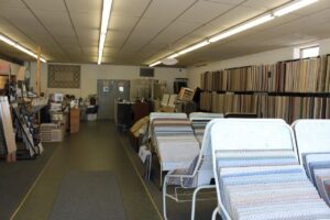 An extensive display of carpet sample racks inside the showroom of Eatherton's Fashion Floors in St. Louis, MO.