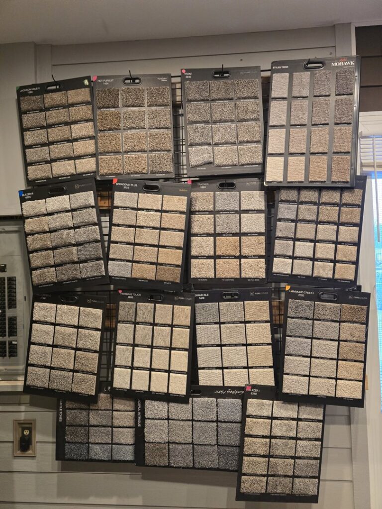 An extensive wall display of carpet samples for residential and commercial clients at Big Red Flooring in Omaha, NE