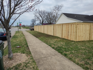 An extensive wood privacy fence installed along a residential road by Veteran Fence in North Royalton, OH.