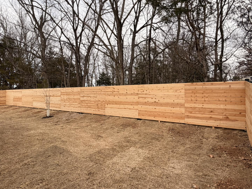 An extensive wood privacy fence installation by Old School Fence Co. in Springfield, MO.